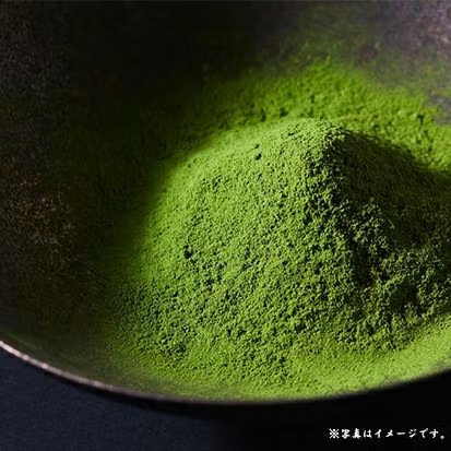 Fine Japanese matcha powder in a dark tea bowl